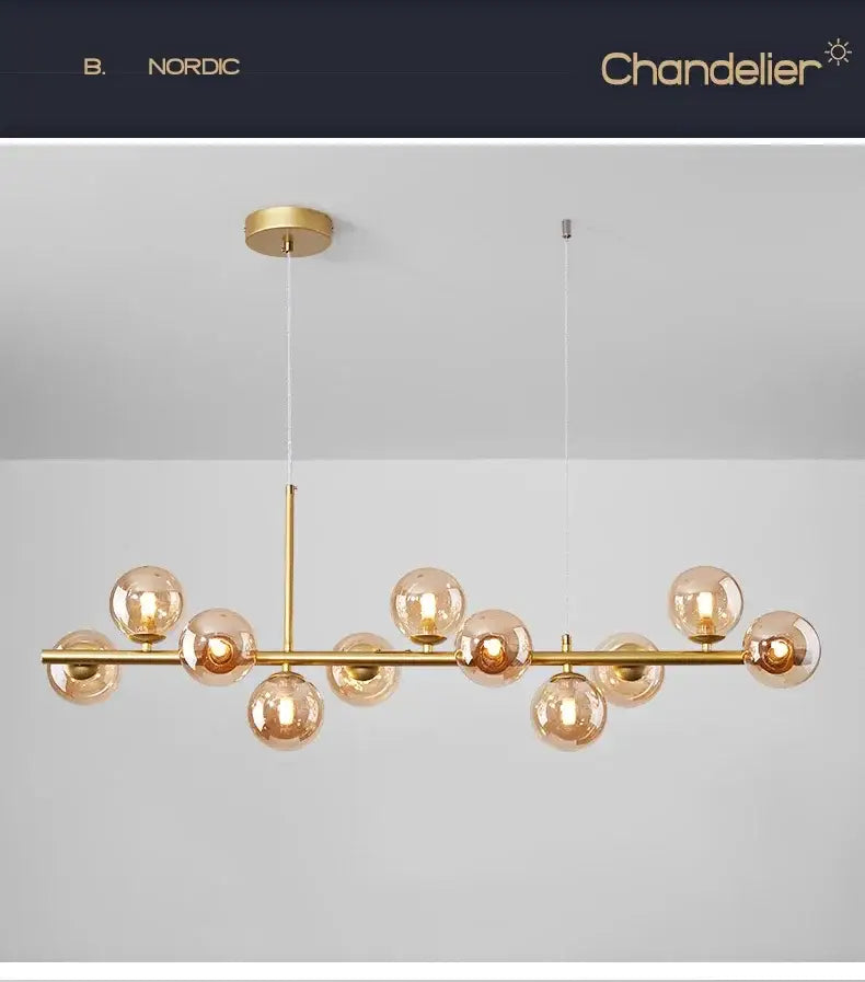 Decorbites™ gold-toned glass ball chandelier with amber glass globe bulbs on sleek horizontal bar for home lighting