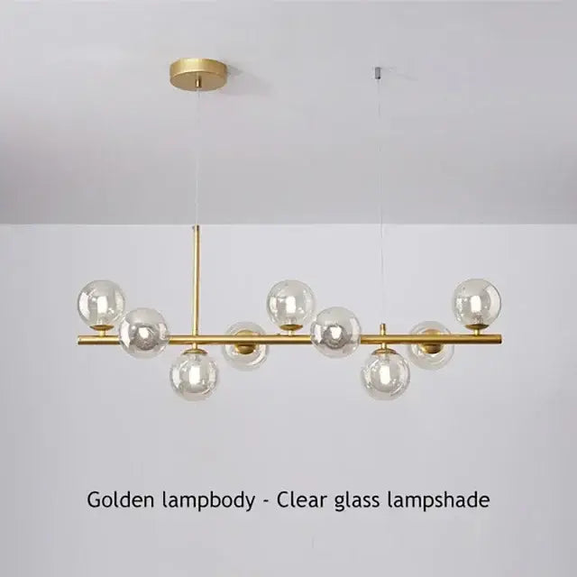 DecorBites™ glass ball chandelier with clear glass globe shades and sleek brass frame for elegant home lighting