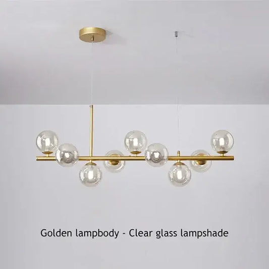 DecorBites™ glass ball chandelier with clear glass globe shades and a sleek brass frame for modern home lighting