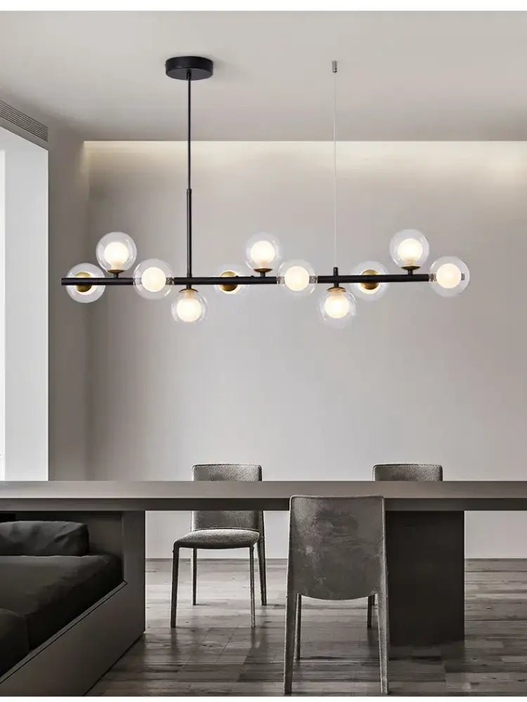 Modern black metal lighting fixture featuring spherical glass ball chandelier bulbs for contemporary ceiling decor