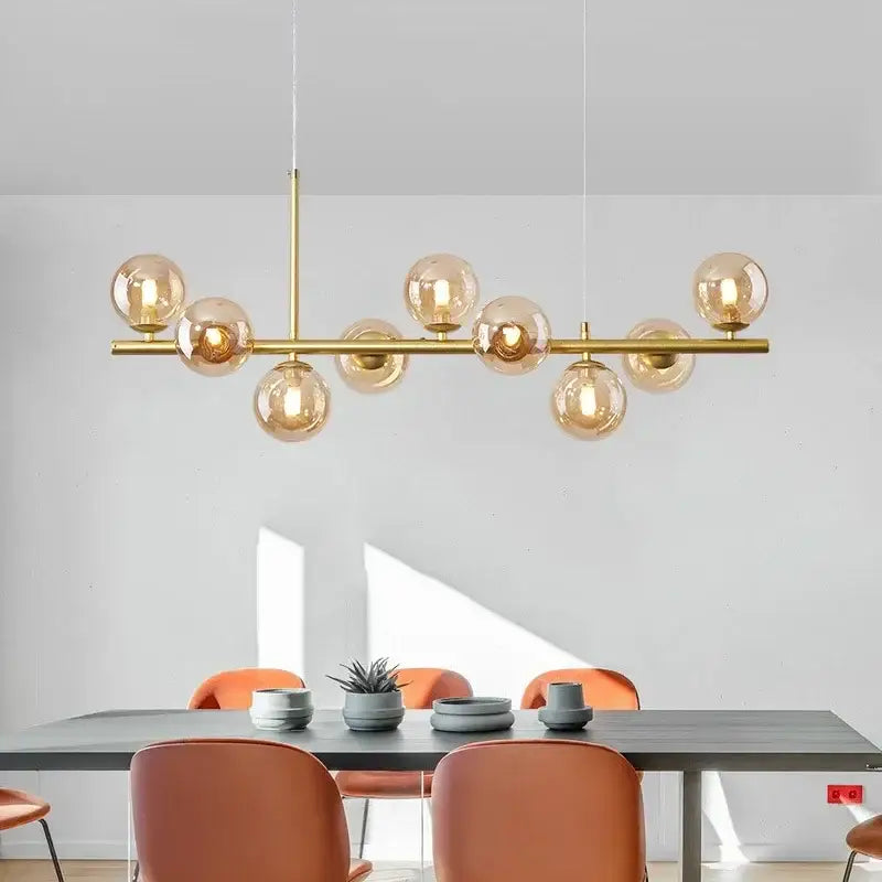 DecorBites™ glass ball chandelier with gold-toned horizontal bar and amber glass globe lighting fixture
