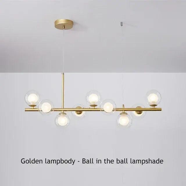 Golden decorbites™ glass ball chandelier with spherical glass shades housing illuminated bulbs lighting fixture
