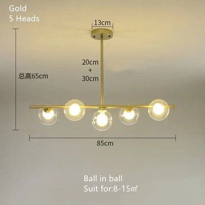 Gold-colored modern decorbites glass ball chandelier with five spherical glass bulbs in a linear LED pendant design