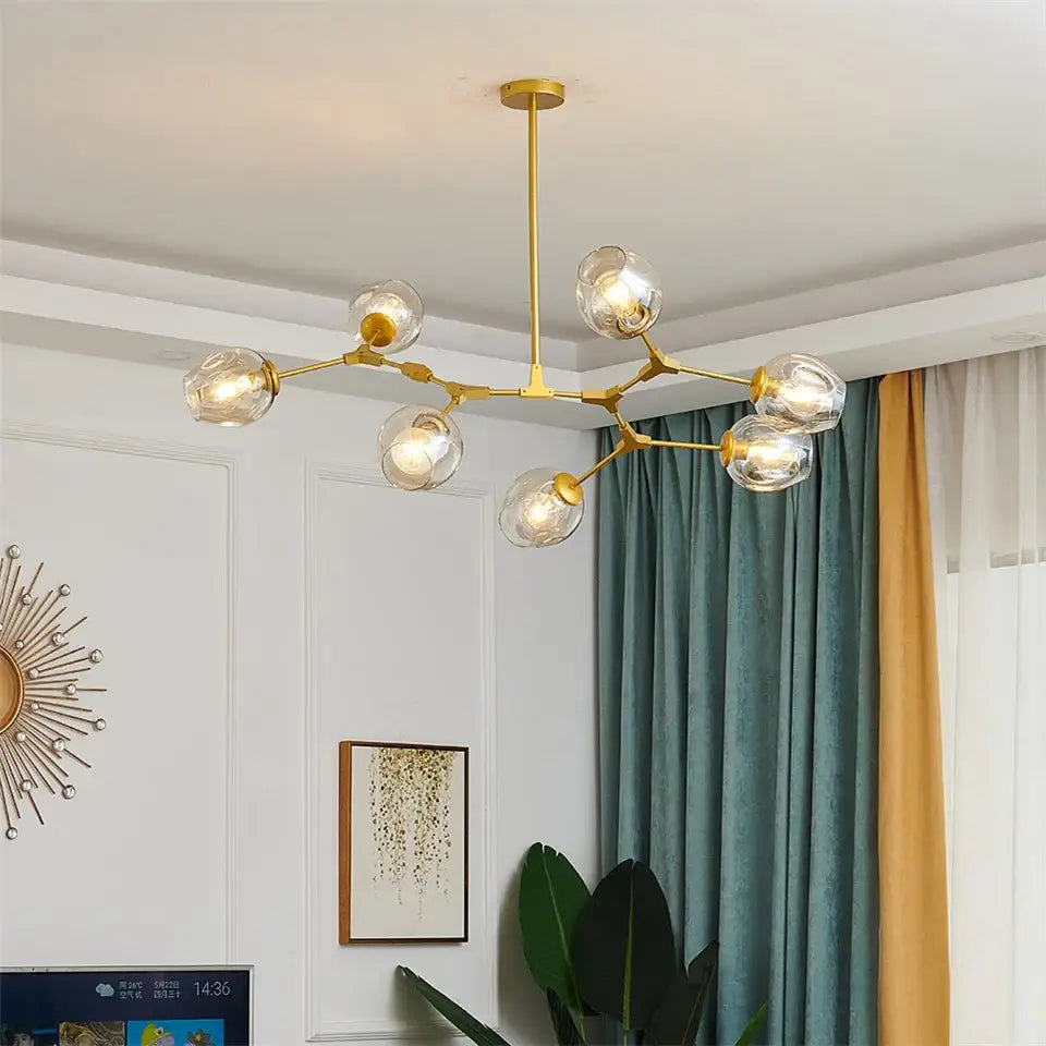 Gold-toned DecorBites™ glass ball led chandelier with clear glass globe bulbs and a branching metal frame in Nordic style