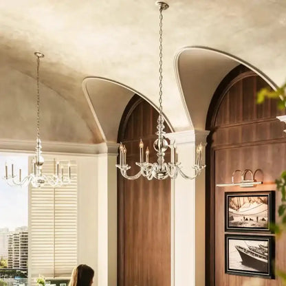 A silver-toned decorbites glass branch LED chandelier with clear crystal accents and candle-style lights for living room