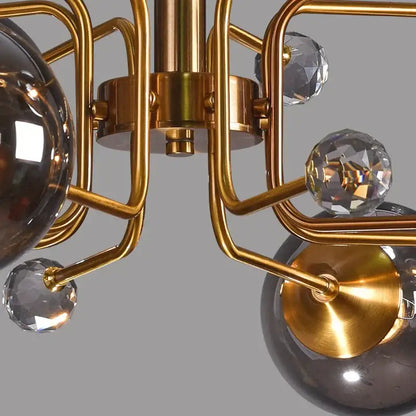 Gold-toned decorbites glass bubble chandelier with faceted crystal spheres and dark smoked glass globes for living room light