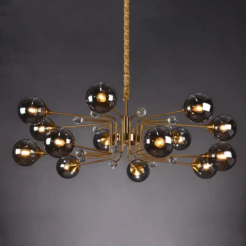 Gold-toned decorbites glass bubble chandelier with dark smoked glass globes and clear crystal accents for living room lighting