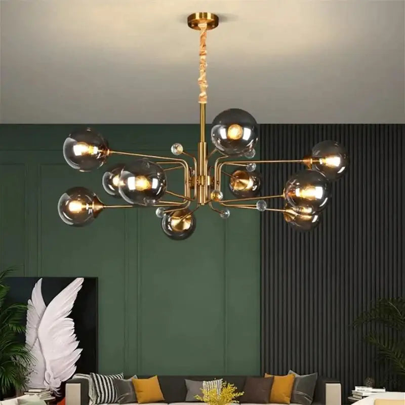 Gold-toned decorbites glass bubble chandelier with smoked glass globes and crystal accents for living room lighting