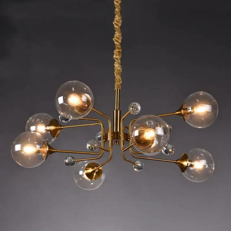 Gold-toned decorbites glass bubble chandelier with clear globe bulbs and crystal accents for living room lighting