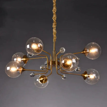Gold-toned decorbites glass bubble chandelier with clear globe bulbs and crystal accents for living room lighting