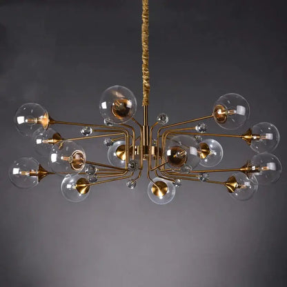 Gold-toned decorbites glass bubble chandelier featuring clear glass globe bulbs and crystal accents for living room lighting