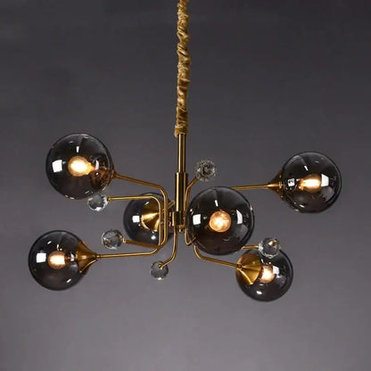 Gold-toned decorbites glass bubble chandelier with five smoked glass globes and crystal accents for living room light