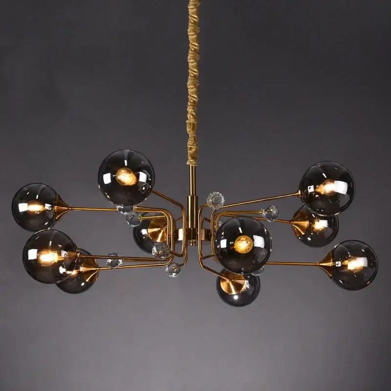 Gold-toned decorbites glass bubble chandelier with dark smoked glass globes and clear crystal accents for living room lighting