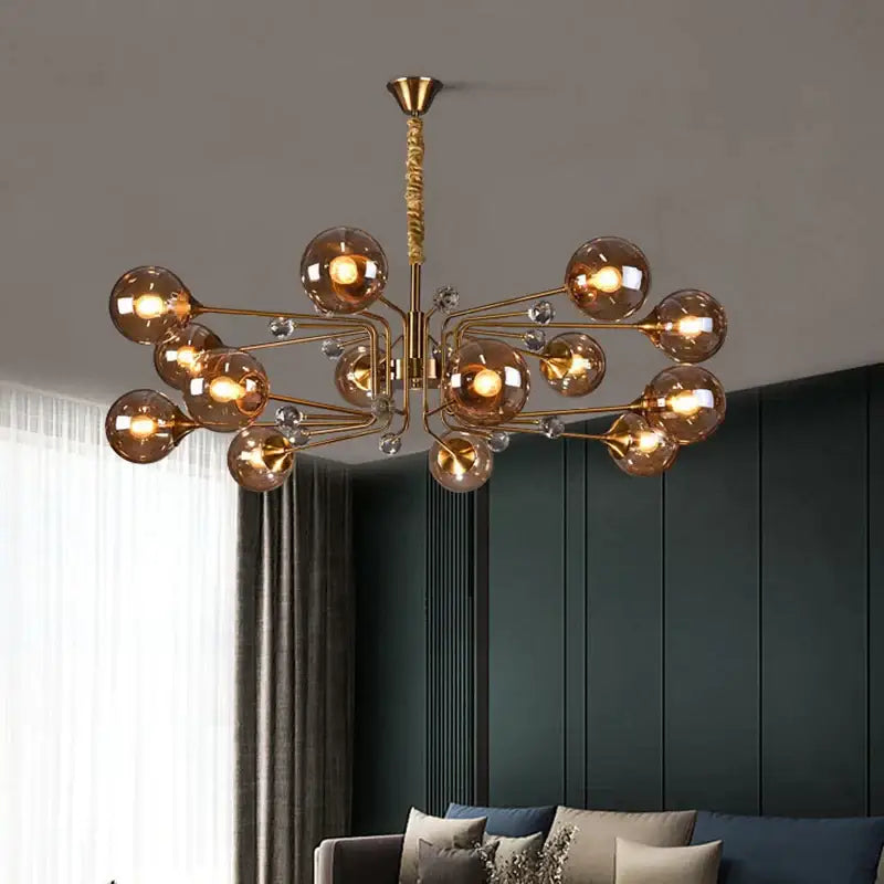 Gold-toned decorbites glass bubble chandelier with amber glass spheres and clear crystal accents for living room light