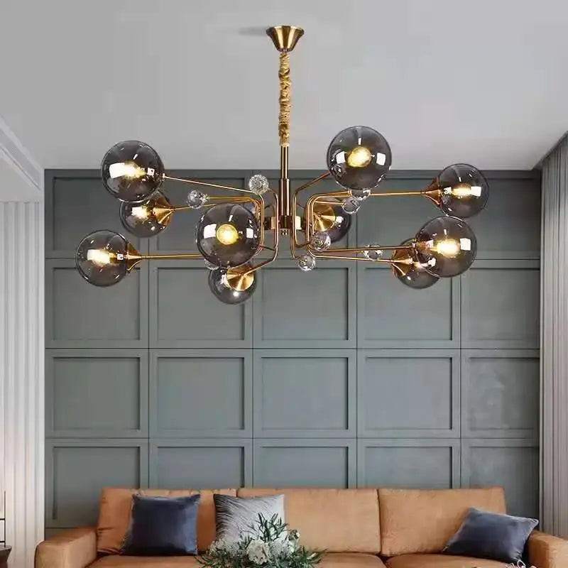 Gold-toned decorbites glass bubble chandelier with smoked glass globes and crystal accents for living room lighting