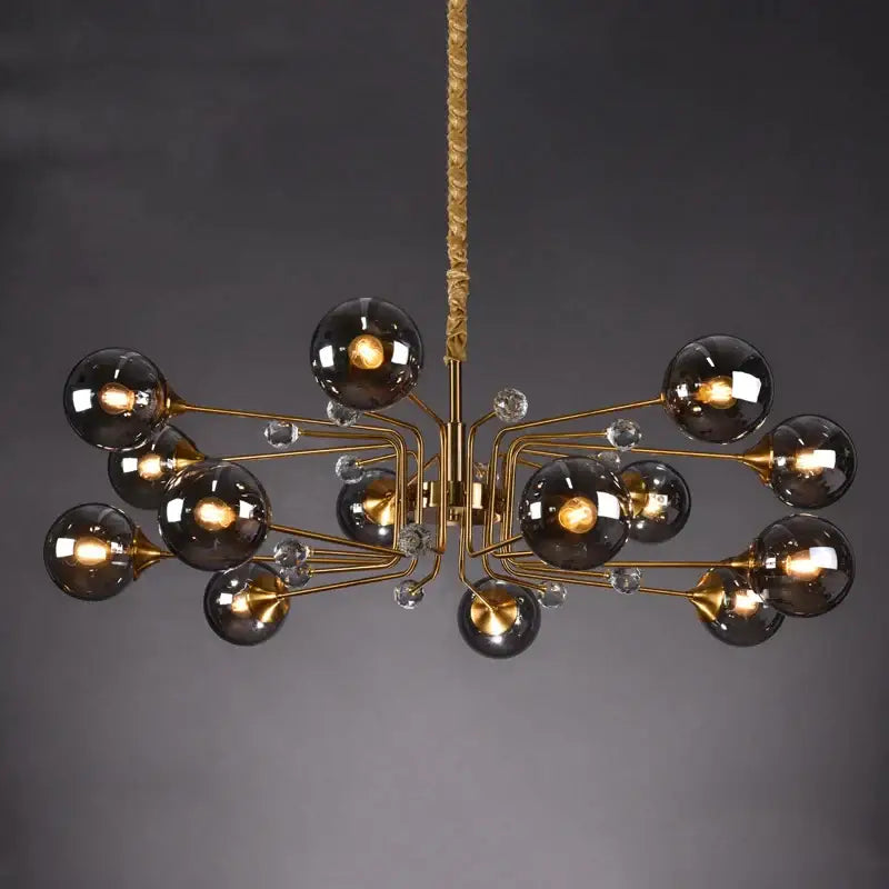 Gold-toned decorbites glass bubble chandelier with dark smoked glass globes and crystal accents for living room light