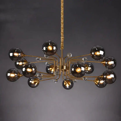 Gold-toned decorbites glass bubble chandelier with dark smoked glass globes and crystal accents for living room light