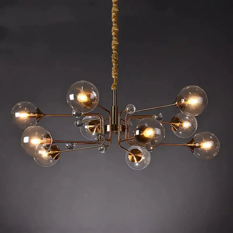 Brass-toned decorbites glass bubble chandelier with clear glass globe bulbs and crystal accents for living room lighting