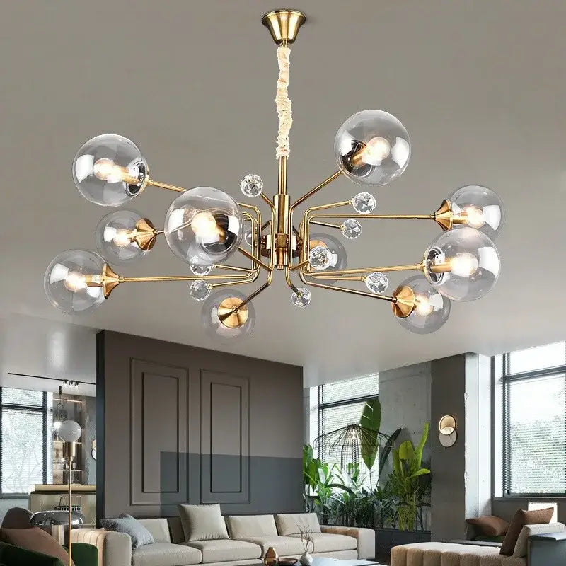 Gold-toned decorbites glass bubble chandelier with clear glass globe shades and crystal accents for living room light