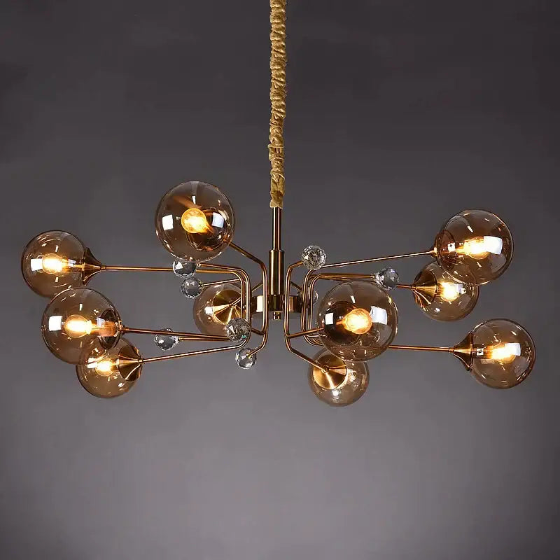 Bronze-finished decorbites glass bubble chandelier with amber glass globes and crystal accents for living room lighting