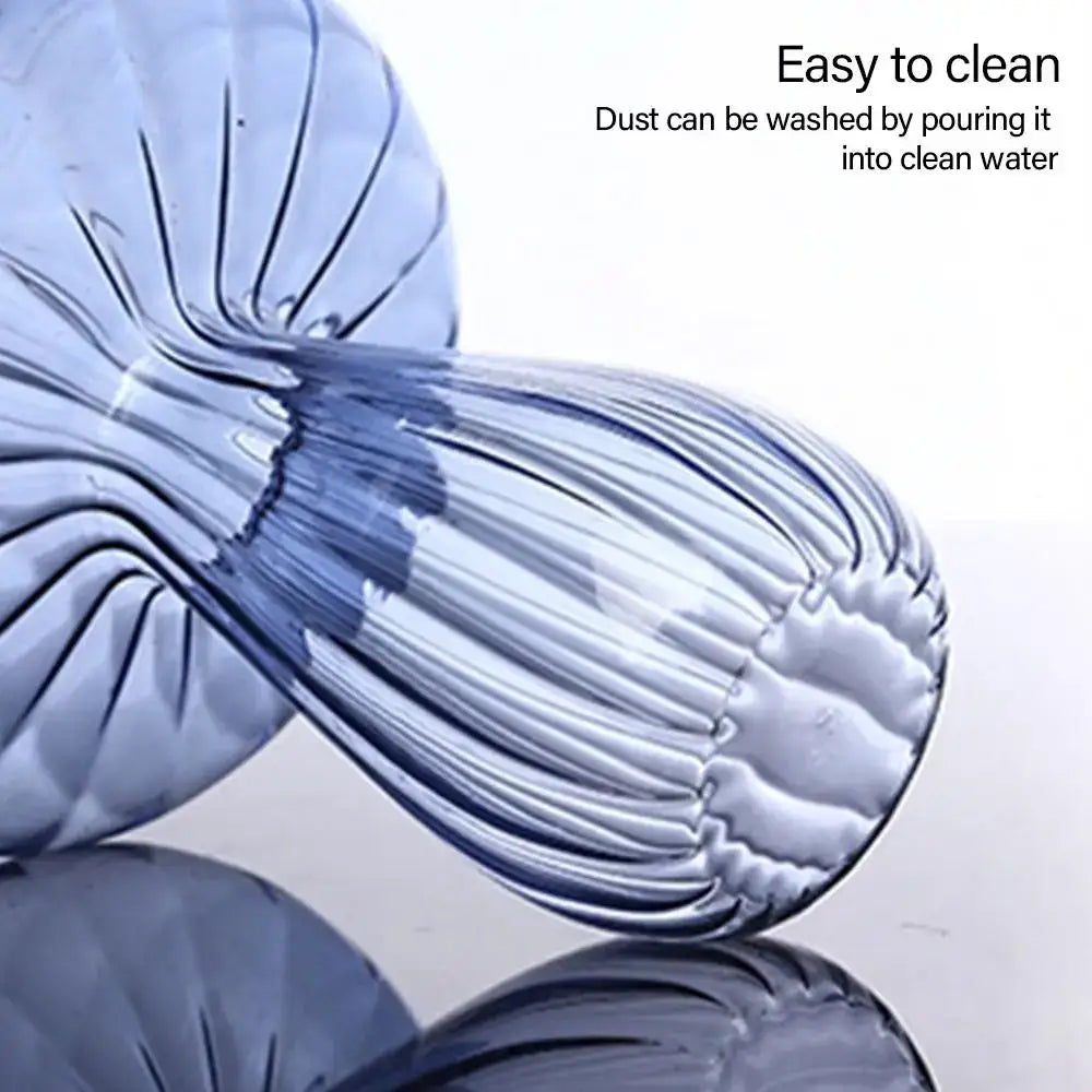 Translucent blue plastic water bottle with ribbed texture and contoured shape used as a mushroom shaped vase for decor