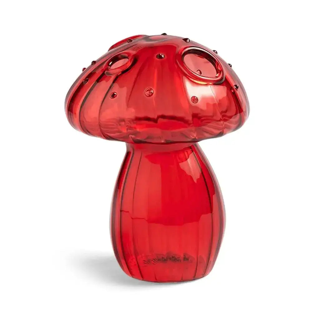 Vibrant red glass mushroom shaped vase with textured ridges and circular cutouts for home decor by DecorBites™
