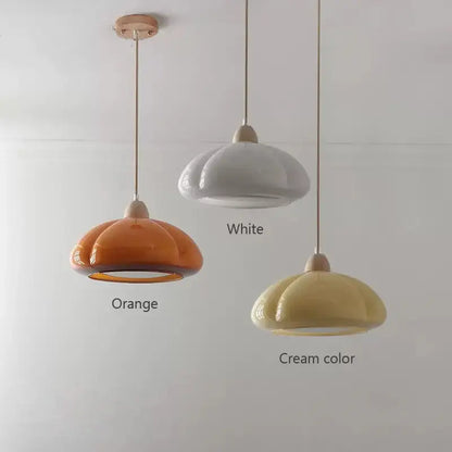 Three ceramic pendant lamps with a soft petal design in orange white and cream for decorbites glass pendant lamps