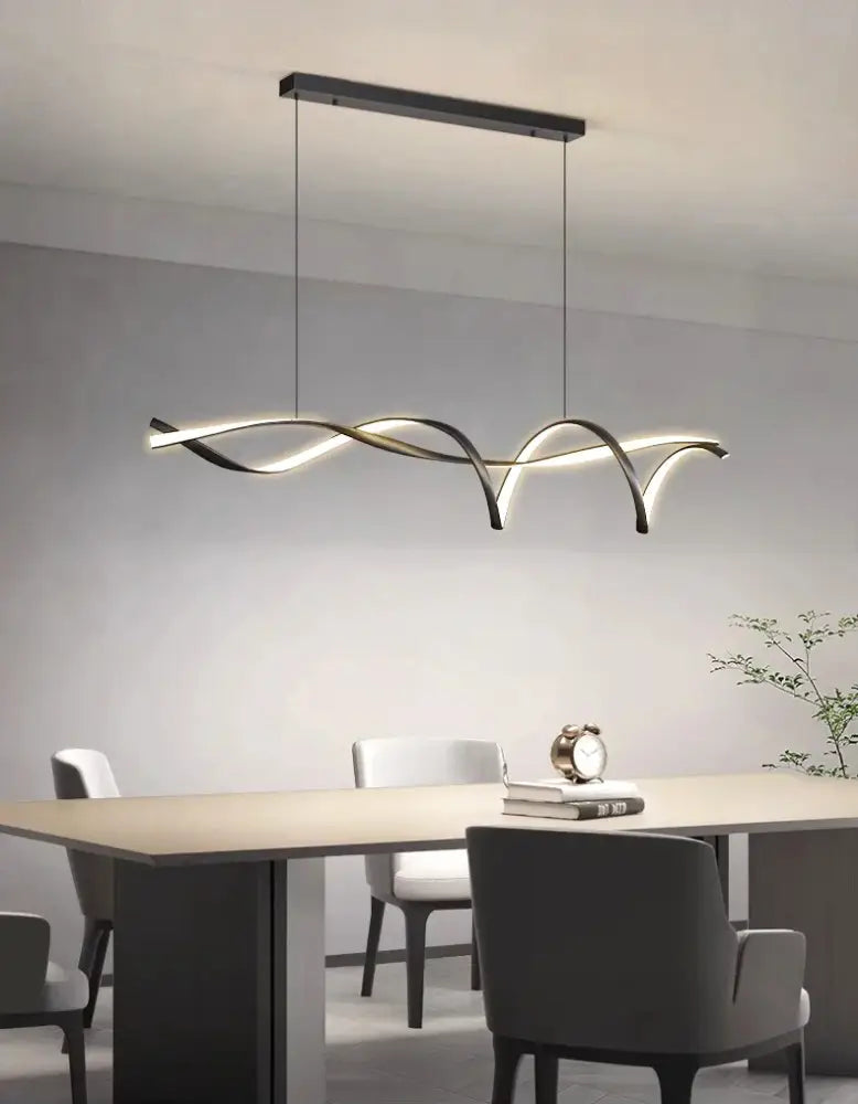 Modern black and gold glass pendant light with sleek wave-like design featuring energy-efficient LED for home decor