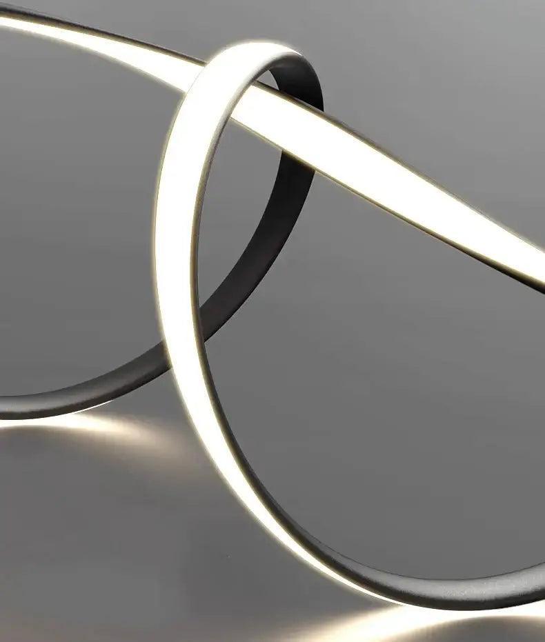 A sleek decorbites glass pendant light with black casing and bright white led illumination for modern home decor