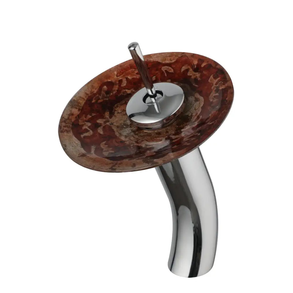 Chrome-finished basin faucet with glass rocker handle and waterfall mixer taps over a marbled brown glass basin