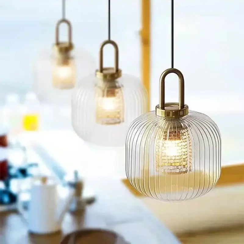 Clear glass decorbites glass stripe pendant lights with vertical ridges and brass-finished frame for dining room use
