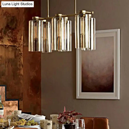 Modern brass and glass suspension pendant light fixture with cylindrical shades for island ceiling and dining room use