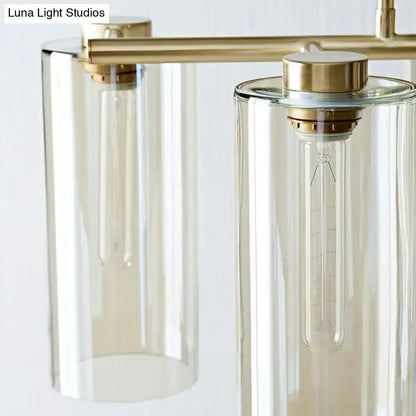 Modern brass-finished DecorBites™ suspension pendant light with clear glass shades for island ceiling and dining room