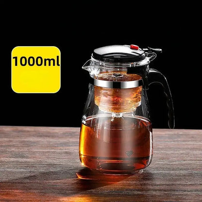 Decorbites glass tea kettle with clear glass body, black handle and lid, and stainless steel infuser basket inside