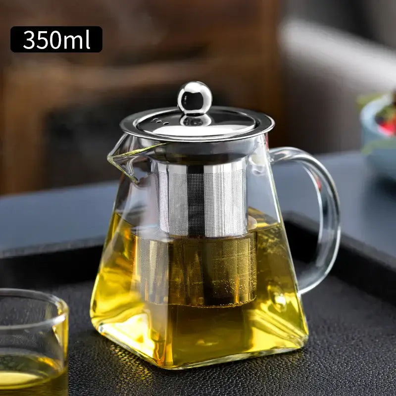 Decorbites glass tea pot with stainless steel lid and built-in filter holding 350ml golden tea in clear glass