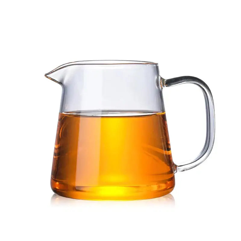 Decorbites™ glass tea pot set with infuser features a clear glass tea pot filled with amber puer tea for brewing