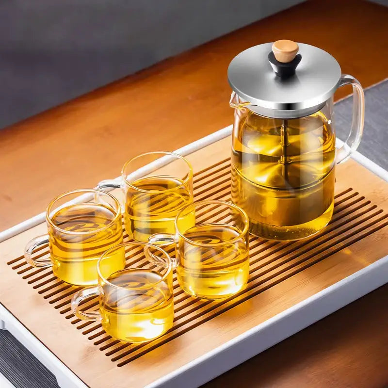 DecorBites glass tea pot with stainless steel lid wooden knob and four matching clear glass cups for herbal tea