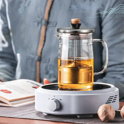 Clear glass tea set by decorbites with stainless steel lid wooden knob filled with golden tea for kung fu style brewing