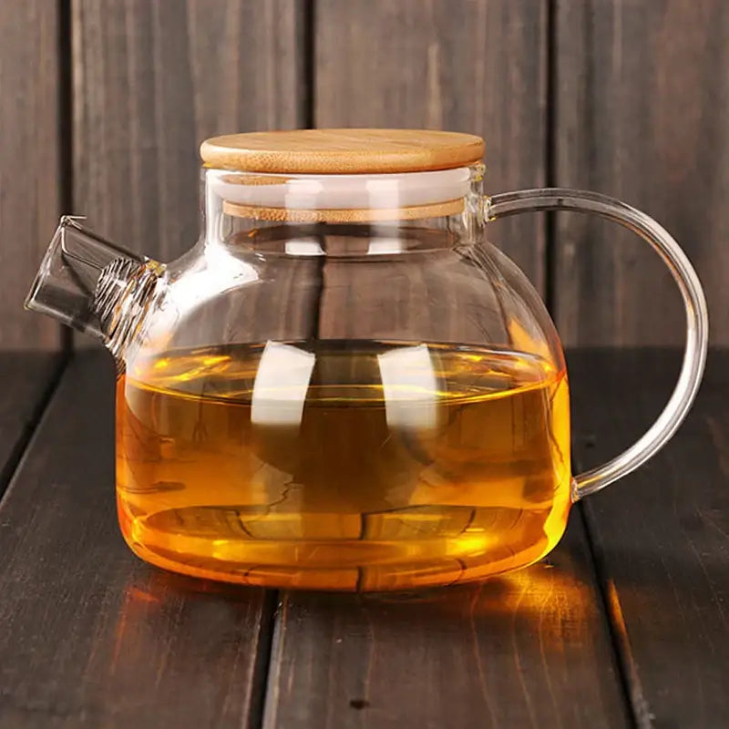 Decorbites glass teapot large capacity clear glass teapot cold with bamboo lid and curved handle filled with amber tea