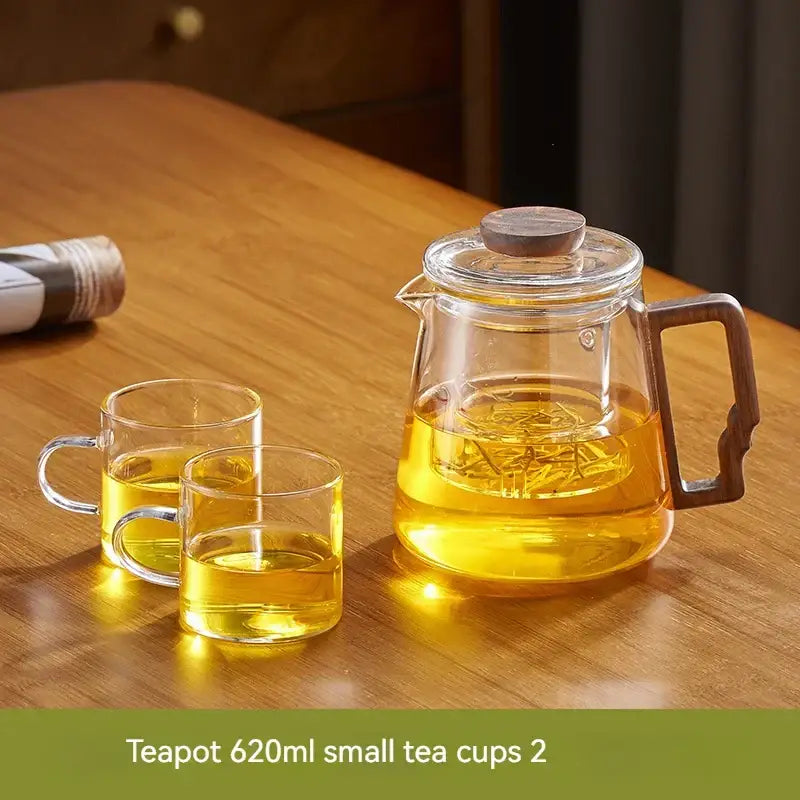 DecorBites glass teapot with wooden handle and lid filled with golden tea for high temp kung fu tea set use