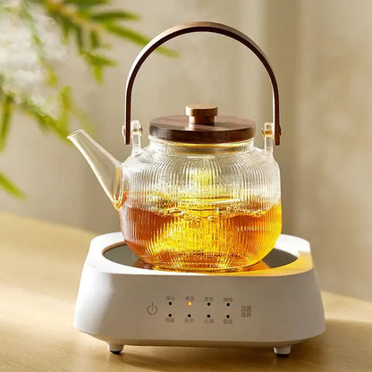 DecorBites glass teapot set with clear ribbed glass, wooden lid and handle on white electric heating base