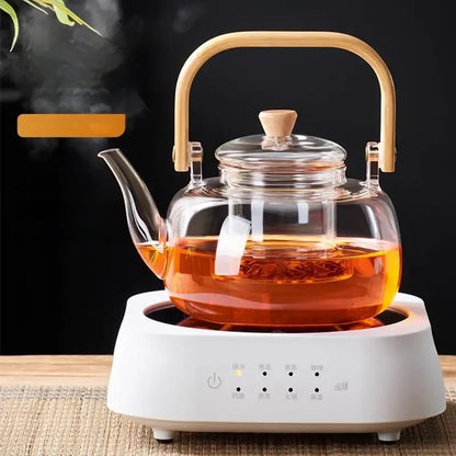 Clear glass teapot with bamboo handle and lid on white electric base decorbites glass teapot for tea and coffee