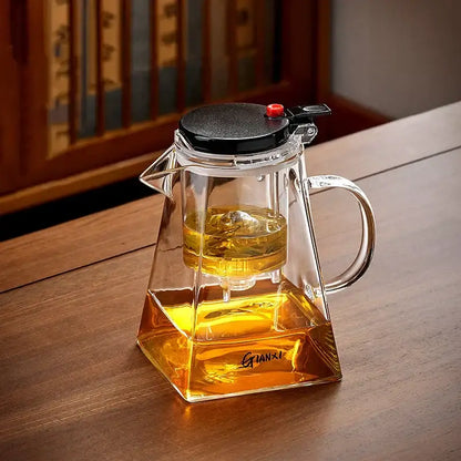 Clear glass decorbites glass teapot with black lid and red knob featuring tea brewing one-button filter design