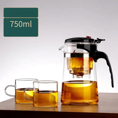 DecorBites glass teapot 750ml clear glass infuser pot with black lid and handle filled with brewed tea