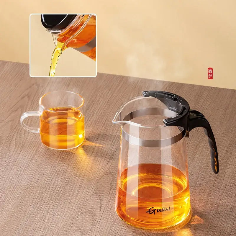 Clear glass decorbites glass teapot with black handle lid silver rim and one-button filtering system