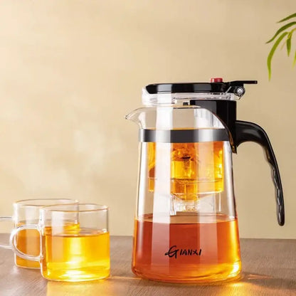 Clear glass decorbites glass teapot with black lid and handle featuring one-button filtration for tea brewing