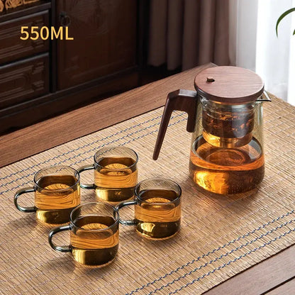 Clear glass decorbites glass teapot with dark wood handle lid and internal infuser for heat resistant brewing
