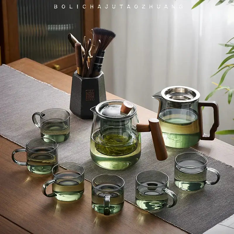 Clear glass decorbites glass teapot with wooden handle and lid knob with matching transparent cups for Chinese tea ceremony