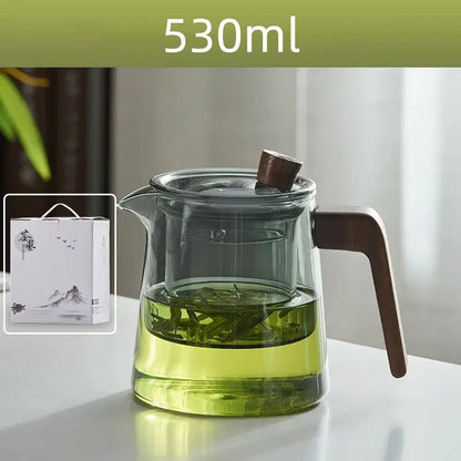 530ml decorbites glass teapot with wood handle and knob filled with green tea leaves steeping in clear liquid