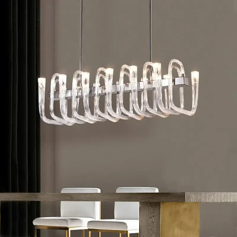 DecorBites glass tube dining chandelier with curved transparent acrylic arms and sleek chrome central frame